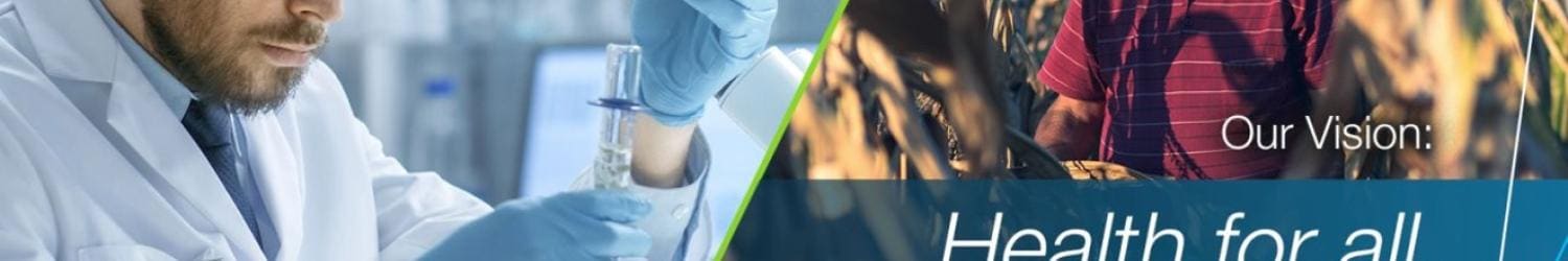 A scientist in a lab with test tubes on the left and a farmer in a cornfield on the right. Text reads: "Our Vision: Health for all, Hunger for none." Bayer logo in the top left corner.