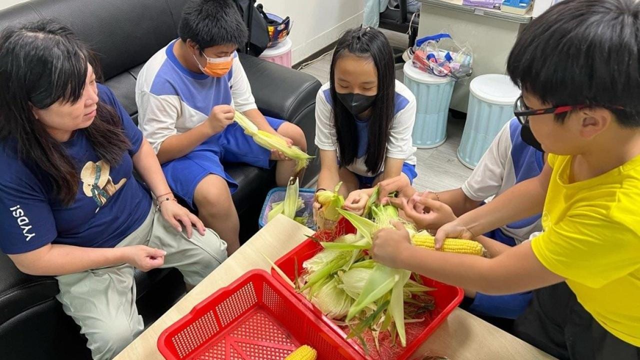 NGO - Taiwan Hope Association for Children and Juvenile - receiving corn donation from Bayer