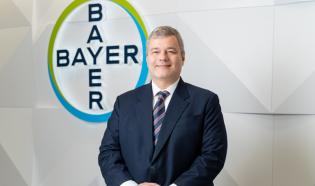 Ingo Brandenburg photo with Bayer logo